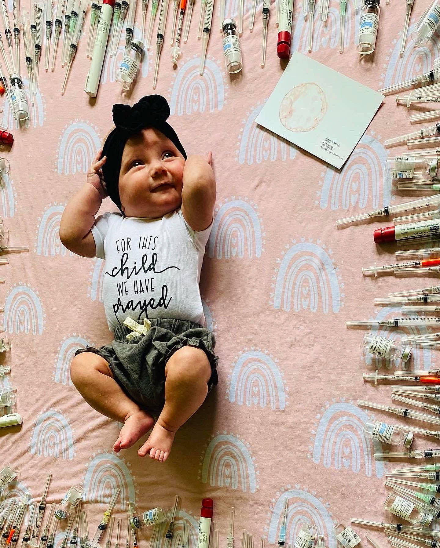 Jayla joined the competition — help win amazing prizes! adaptation, art, child, flooring, font, fun, grass, happy, hat, leisure, pattern, person, sitting, smile, sun_hat, t_shirt, toddler, travel, vacation, visual_arts