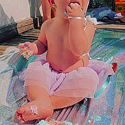 Kahleesi Lynn joined the competition — help win amazing prizes! baby, child, cake, frosting, tutu, outdoor, sunlight, happy, messy, sitting, foot, hand, fingers, face, celebration, party, colorful, food, sweet, playful