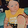 Kahleesi Lynn is registered to the contest to win money with this photo: toddler, child, headband, yellow_clothing, shoe, sole, indoor, person, baby, sitting, blue_blanket, sunflower_pattern, cute, hand, face, footwear, expressionless, home, infant, apparel