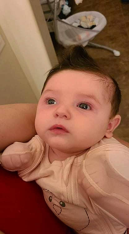 Aurelia is registered to the contest to win money with this photo: baby, baby_toddler_clothing, cheek, ear, eye, eyelash, face, fun, gesture, hair, happy, iris, lip, mouth, nose, person, sitting, skin, toddler, window