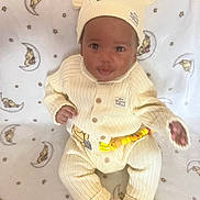 Malachi joined the competition — help win amazing prizes! baby, infant, child, winnie_the_pooh, knitted_clothing, hat, onesie, blanket, pattern, stars, moon, soft_toys, footwear, cute, smiling, portrait, indoors, cozy, seated, looking_at_camera