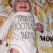 Grayson is registered to the contest to win money with this photo: baby, baseballcap, bed, blanket, bonnet, cap, clothing, diaper, face, furniture, glove, hat, head, newborn, person, photography, portrait, quilt, sleeping, t_shirt