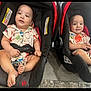 baby, toddler, car_seat, child, indoor, floor, clothing, patterned_shirt, footwearless, smiling, sitting, person, cute, matching_outfits, infant, seat_belt, car_seat_strap, carpet, wood_flooring, happy
