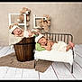 baby, newborn, sleeping, teddy_bear, blanket, hat, wooden_bucket, pillows, bed, floor, carpet, furniture, cute, infant, child, cozy, soft, resting, indoor, portrait