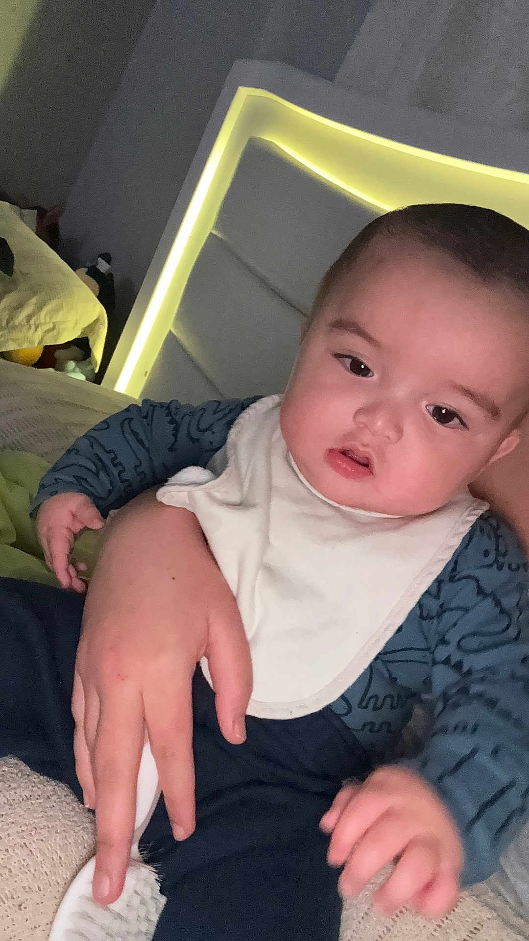 Keylen Zapata is registered to the contest to win money with this photo: baby, bed, bib, blanket, brushing, caretaker, child, clothing, comfort, expression, face, furniture, hand, headboard, indoor, lighting, person, skin, sleeve, young