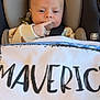 Maverick is registered to the contest to win money with this photo: baby, car_seat, blanket, pacifier, infant, child, seatbelt, clothing, person, young_child, indoor, cute, comfort, portrait, face, head, expression, baby_clothes, seated, safety