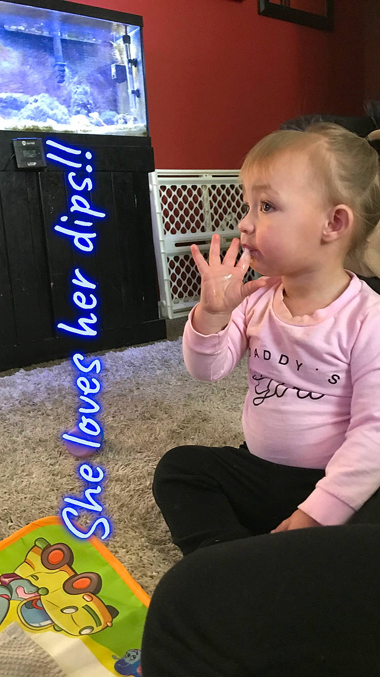 Ava joined the competition — help win amazing prizes! baby, baby_toddler_clothing, black, chair, child, cool, display_device, electric_blue, finger, flooring, font, fun, lap, person, play, product, sitting, t_shirt, thumb, toddler