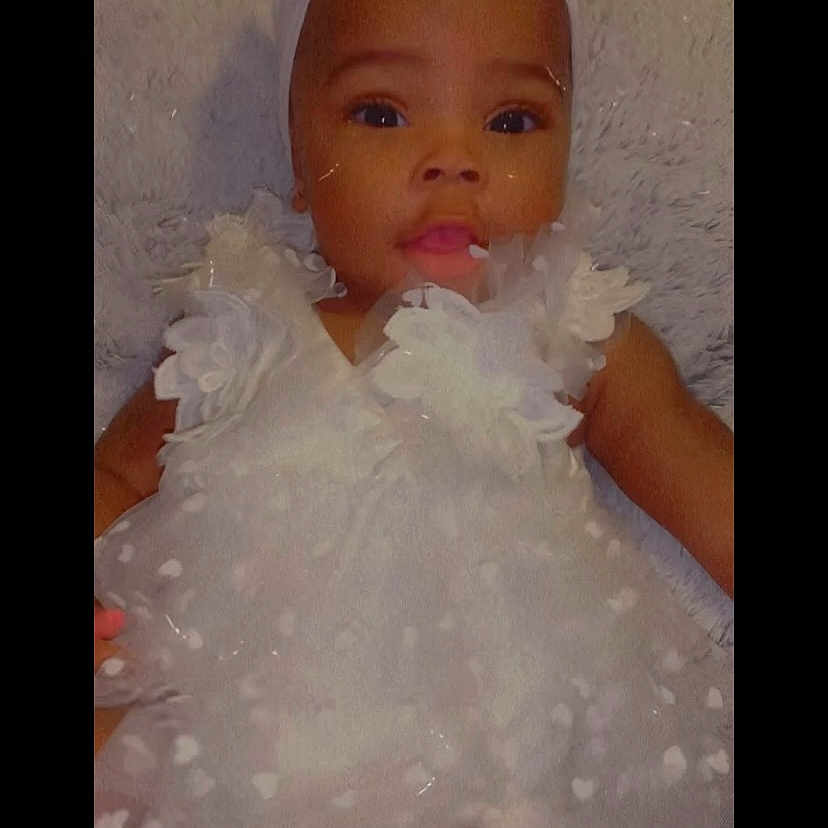 Klani Ariell joined the competition — help win amazing prizes! accessories, baby, bed, bonnet, clothing, costume, dress, face, fashion, flower, hat, head, jewelry, necklace, newborn, person, petal, photography, plant, portrait