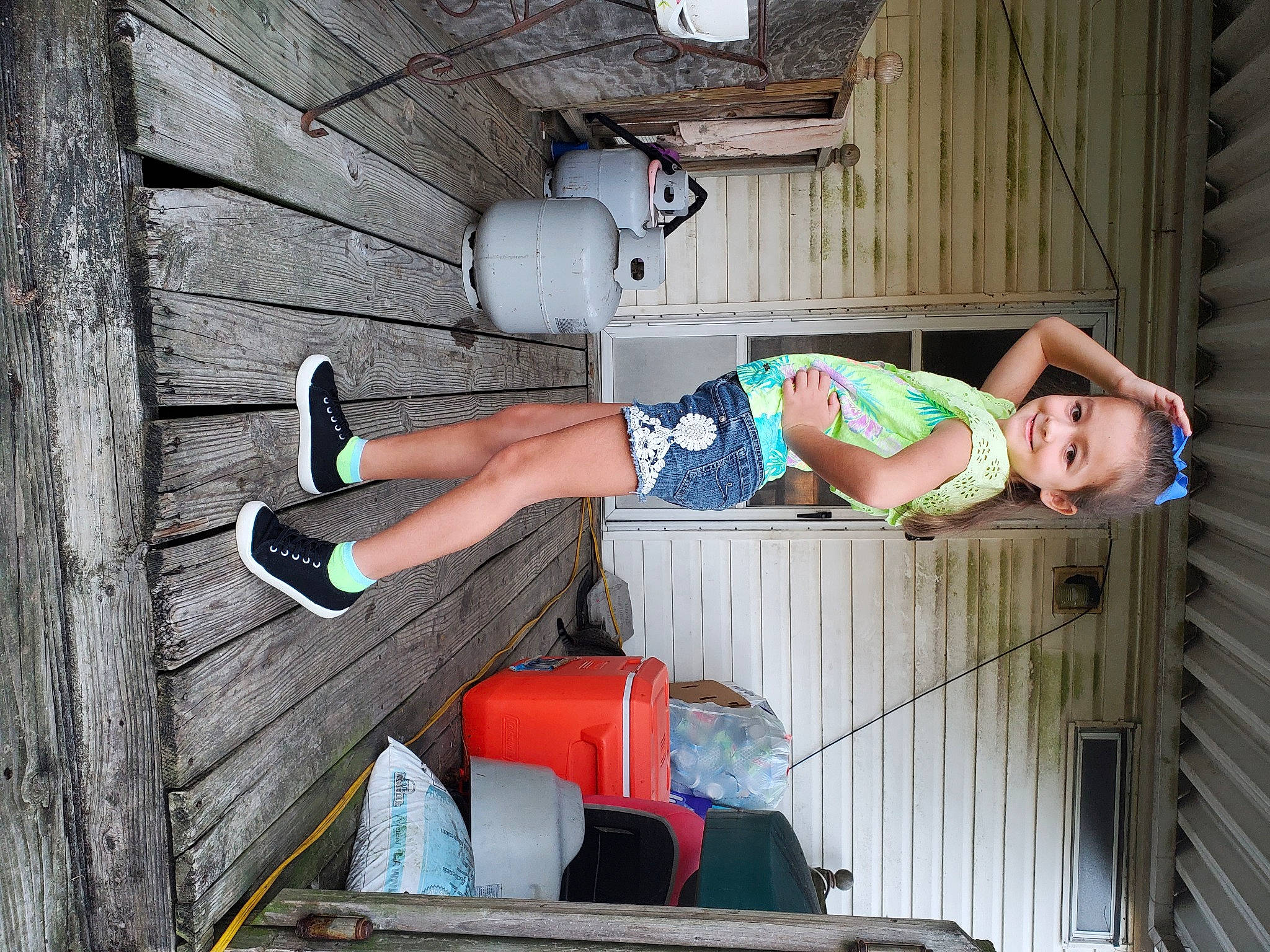 Ailana joined the competition — help win amazing prizes! boot, calf, elbow, foot, footwear, fun, hat, human_leg, joy, knee, person, sandal, shorts, sitting, thigh, wood