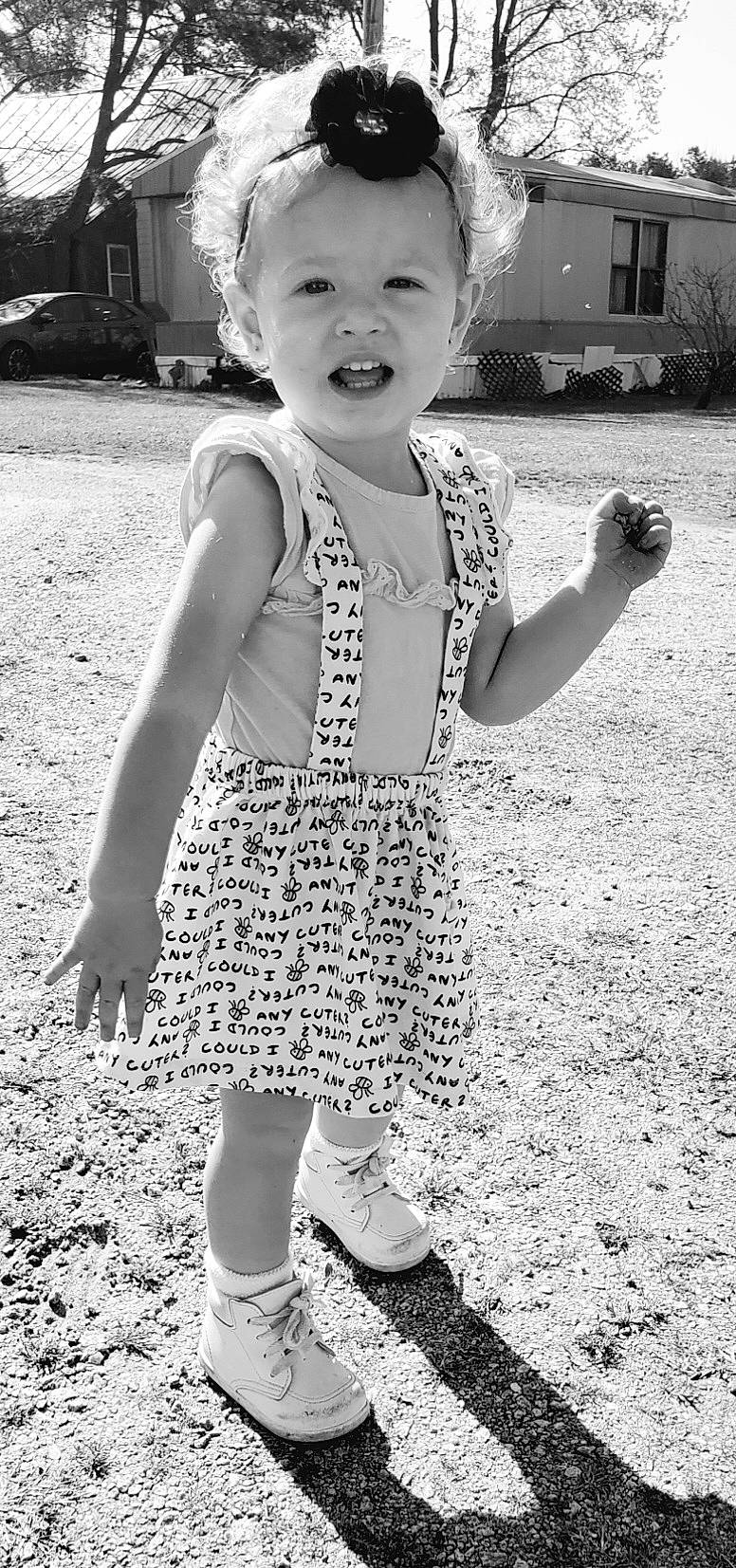 Zoey is registered to the contest to win money with this photo: baby_toddler_clothing, beauty, black, black_and_white, child, finger, flash_photography, gesture, grass, happy, monochrome, monochrome_photography, people, people_in_nature, person, photograph, smile, standing, style, toddler