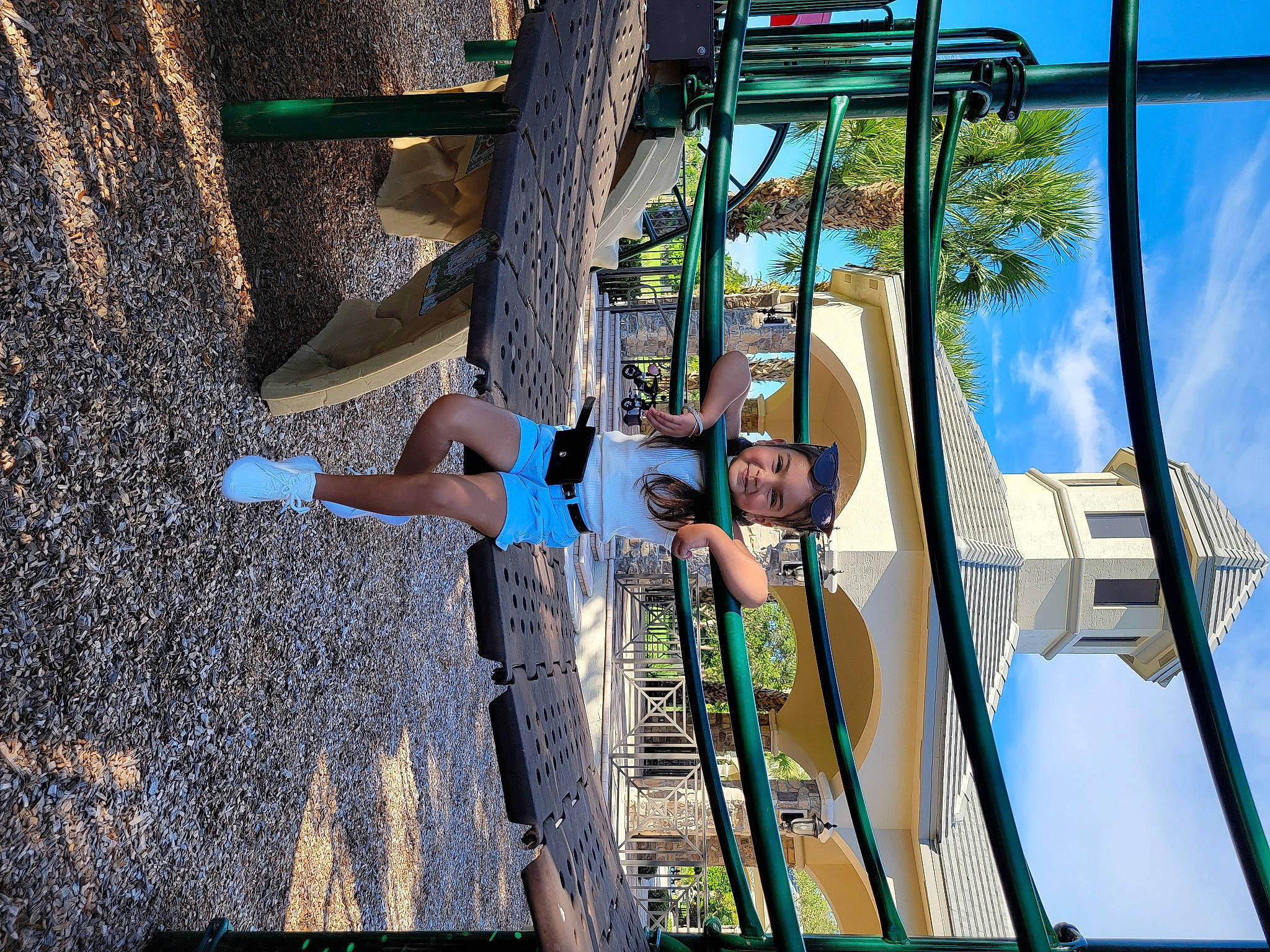 Selena Abdulaziz is registered to the contest to win money with this photo: adventure, azure, city, cloud, elbow, electric_blue, facade, fun, headwear, joy, leisure, metal, outdoor_play_equipment, person, playground, pole, public_space, recreation, rope, shorts