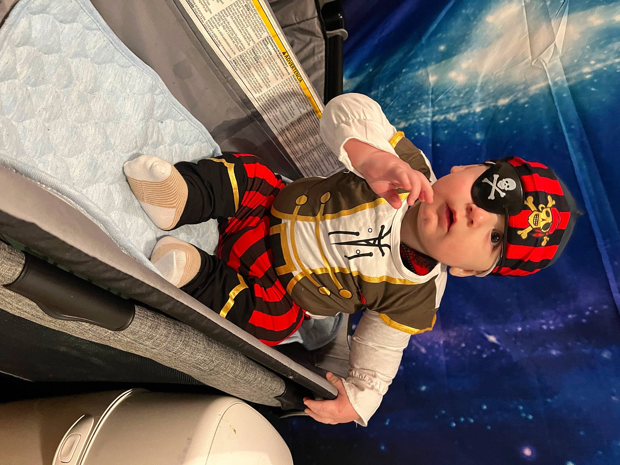 Lucas is registered to the contest to win money with this photo: arm, automotive_design, automotive_exterior, baseball_cap, cap, carmine, cool, elbow, entertainment, fictional_character, flash_photography, fun, games, hat, headwear, human_leg, music, person, personal_protective_equipment, sports_gear