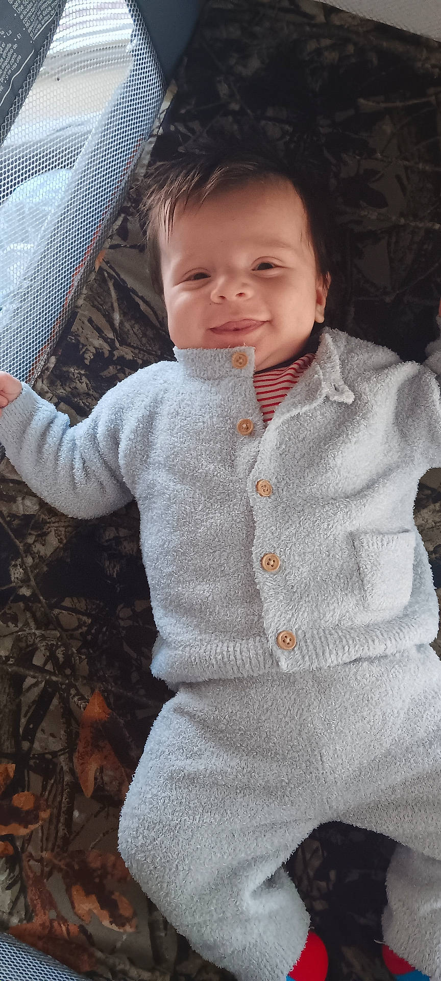 Jaxon is registered to the contest to win money with this photo: baby, bodypart, cardigan, clothing, face, furniture, happy, hat, head, hoodie, knitwear, longsleeve, pants, person, photography, portrait, sleeve, smile, sweater, sweatshirt