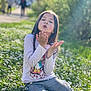 Yuna Lepertel a rejoint le concours — aidez-le/la à gagner de superbes lots ! child, girl, flowers, daisies, grass, outdoor, nature, sitting, long_hair, plaid_pants, purple_shoes, white_shirt, playful, kiss, sunlight, daytime, greenery, people, blurred_background, casual_clothing