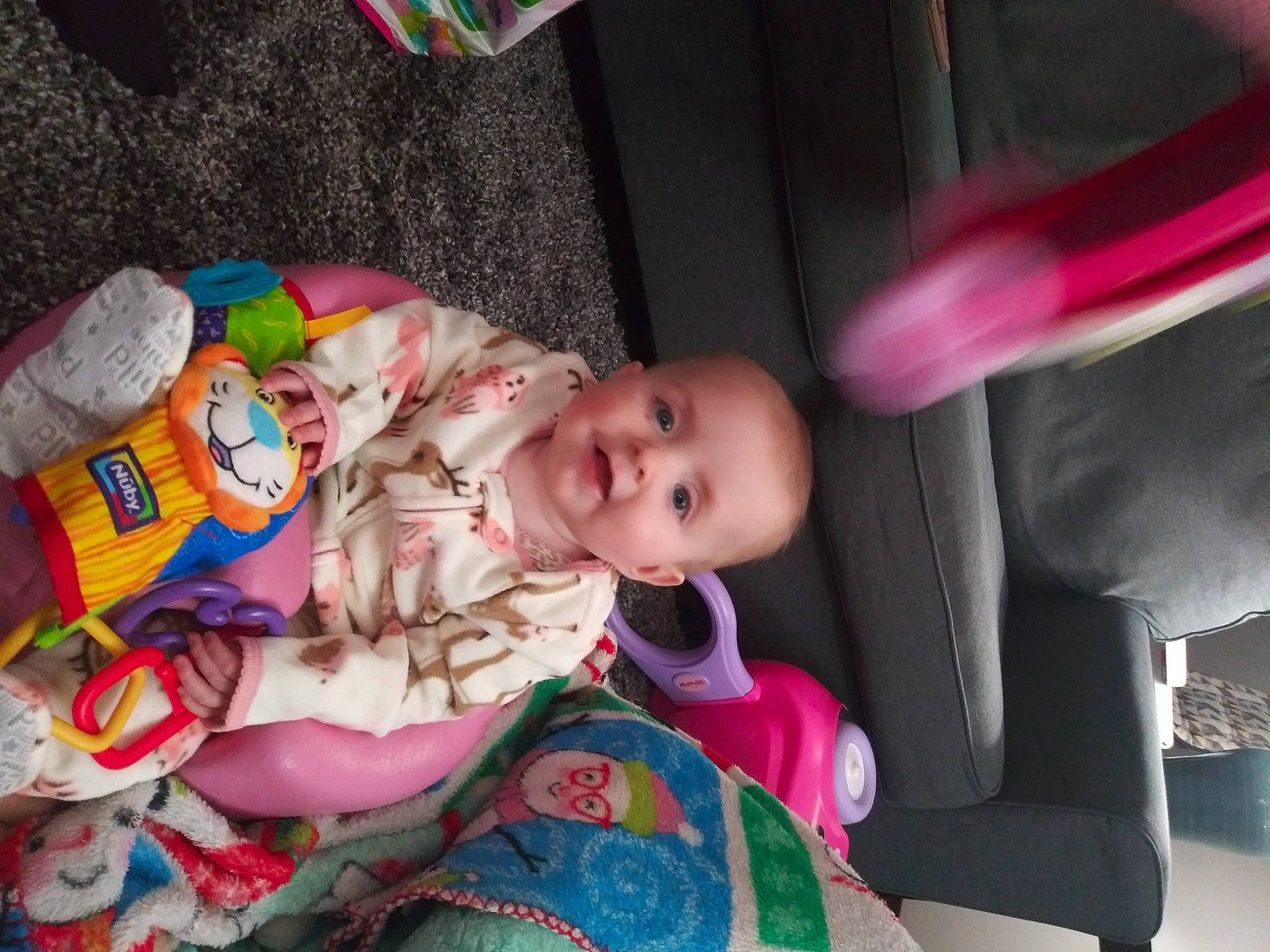 Lillianna joined the competition — help win amazing prizes! baby, baby_carriage, baby_products, baby_toddler_clothing, baby_toys, car_seat, cheek, child, face, fun, happy, head, human_body, magenta, person, pink, room, sitting, smile, textile