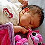 baby, sleeping, infant, pacifier, plush_toy, pink, blanket, cozy, cute, peaceful, child, soft, comfort, indoors, rest, young, portrait, toddler, face, hand