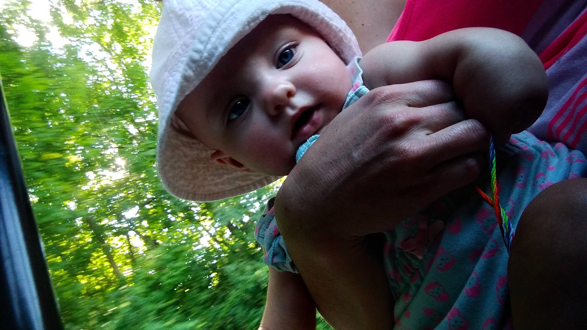 Alivia is registered to the contest to win money with this photo: baby, cap, chest, child, fun, gesture, grass, happy, hat, headwear, leisure, lip, mouth, nose, people_in_nature, person, plant, recreation, skin, sun_hat