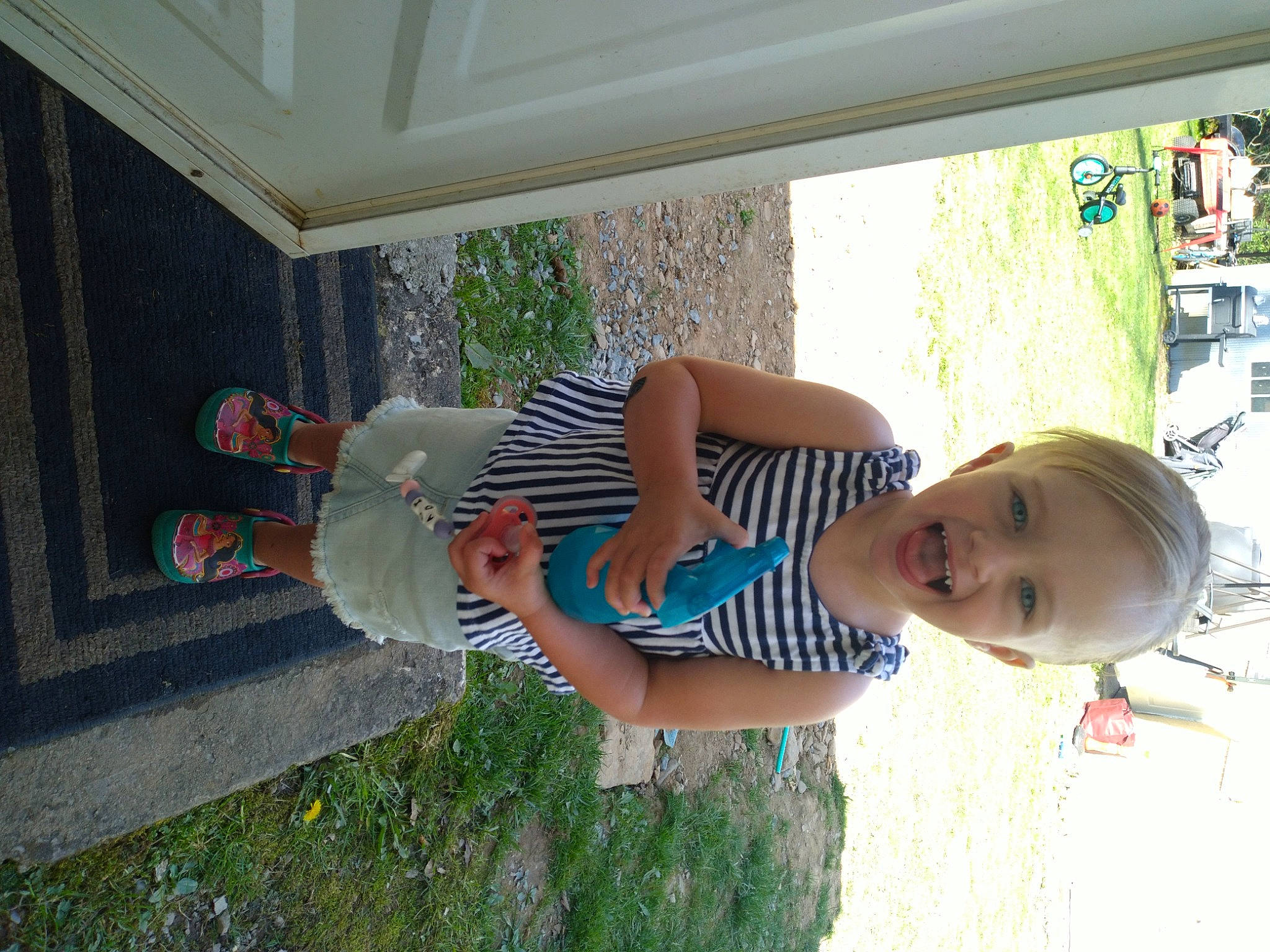 Adilynn is registered to the contest to win money with this photo: baby, baby_toddler_clothing, car, child, door, elbow, fun, grass, hat, house, leisure, person, plant, smile, summer, tire, toddler, tree, vacation, vehicle_door