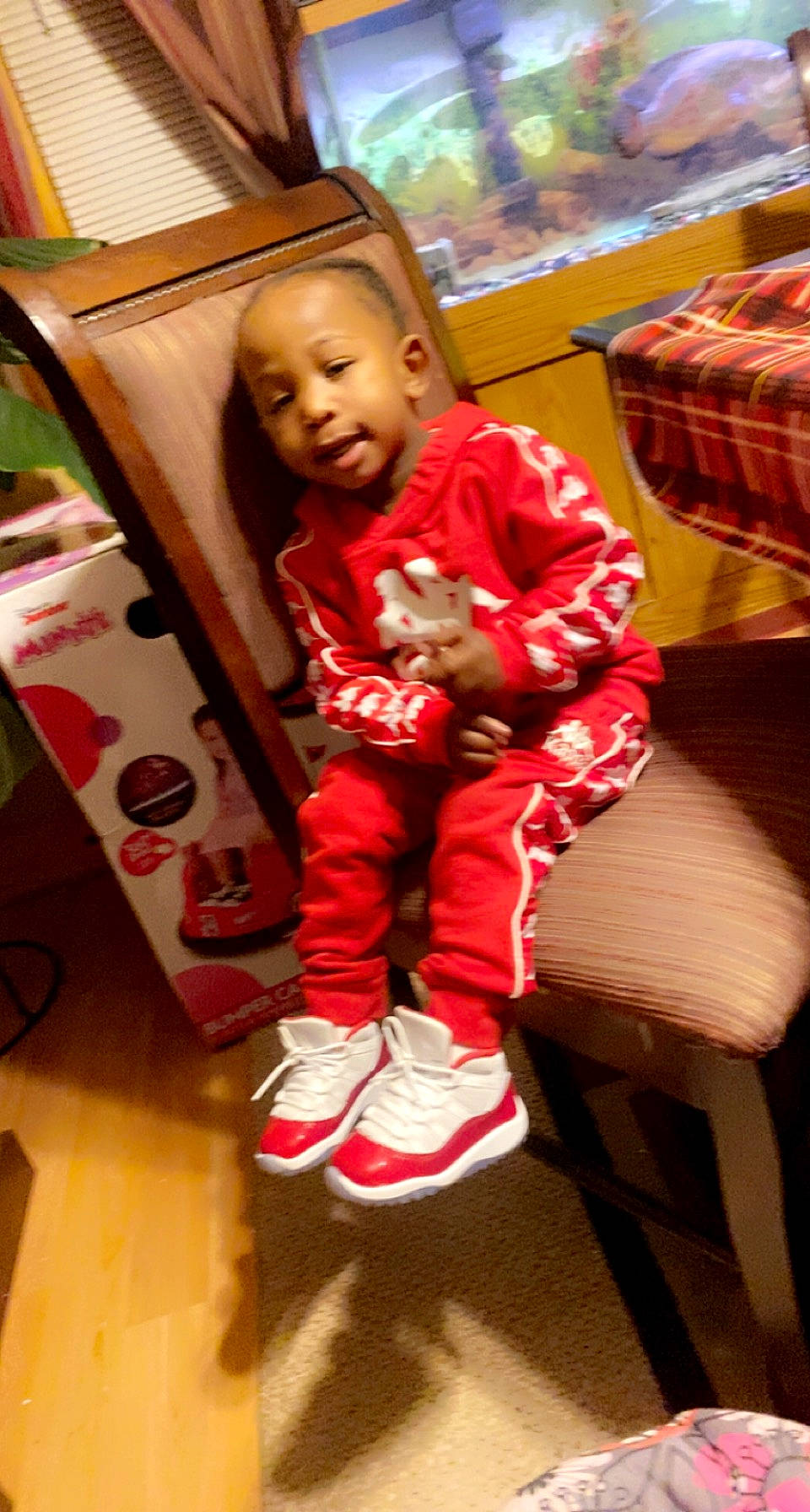 Nazir joined the competition — help win amazing prizes! baby, baby_toddler_clothing, carmine, christmas, event, flooring, foot, fun, happy, holiday, human_leg, person, play, room, shoe, sitting, sleeve, sneakers, sock, toddler