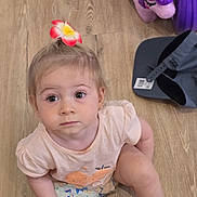 Chloé participe au concours pour gagner de l'argent avec cette photo : toddler, child, flower_hair_clip, pink_shirt, shorts, wooden_floor, toys, purple_unicorn, cap, sitting, looking_up, cute, indoor, person, young_child, casual_clothing, playtime, curious, baby, innocence