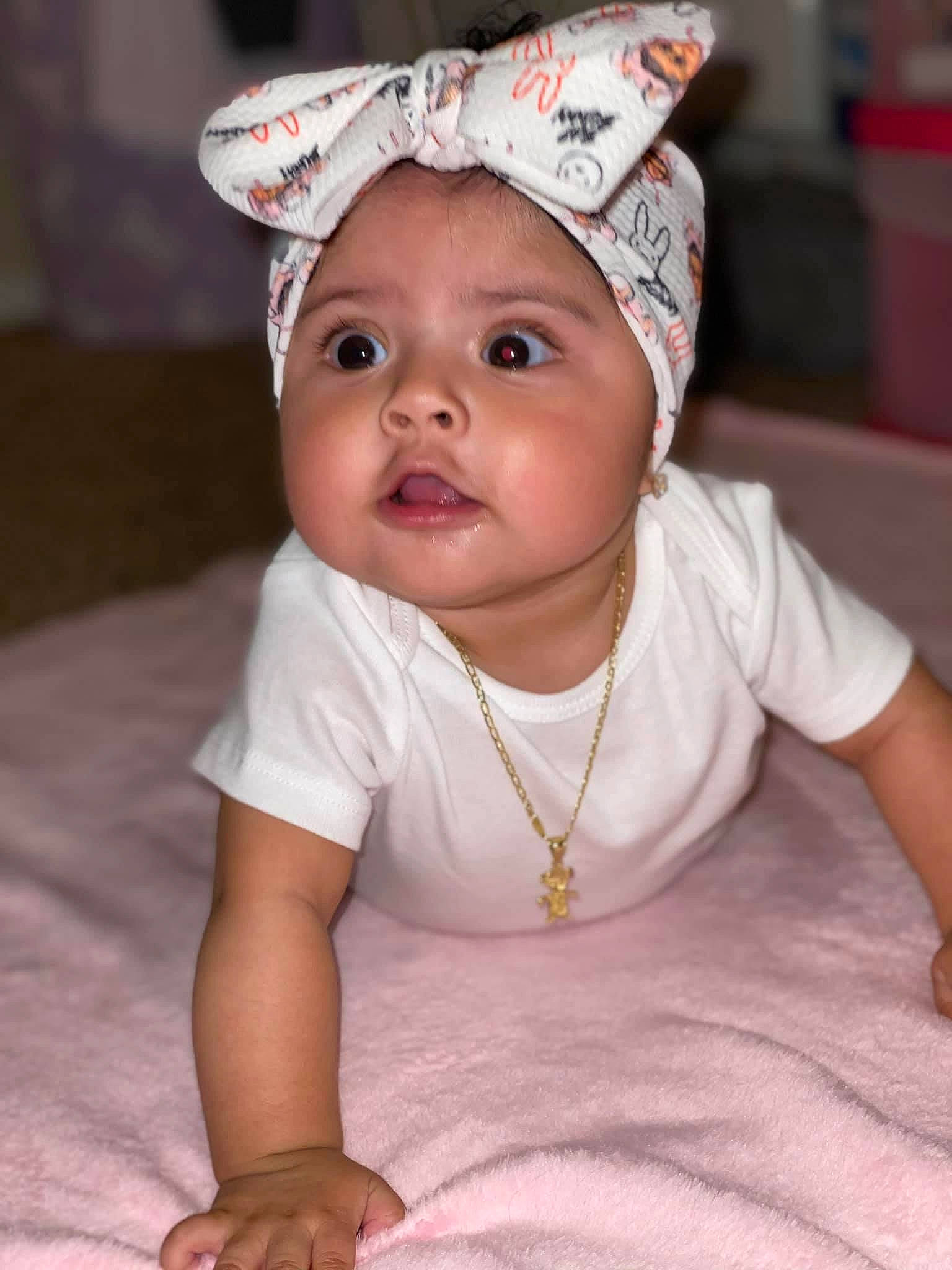 Daniela joined the competition — help win amazing prizes! baby, baby_toddler_clothing, bonnet, cheek, child, fashion_accessory, hat, head, headgear, headwear, lip, person, pink, skin, smile, surprise, toddler