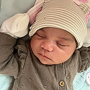 Stori joined the competition — help win amazing prizes! baby, sleeping, hat, striped_hat, bear_ears, knitted_sweater, brown_sweater, infant, cute, cozy, soft_surface, blanket, pink_blanket, newborn, face, closed_eyes, resting, child, cute_outfit, adorable
