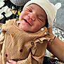 Stori is registered to the contest to win money with this photo: baby, newborn, smiling, infant, hat, clothing, hand, person, cute, cozy, fabric, cushion, blanket, indoor, portrait, sleepy, resting, soft, warm, comfort