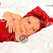 Susannah joined the competition — help win amazing prizes! baby, bow, child, cute, eyes, face, hand, headband, indoors, infant, lying_down, newborn, portrait, red_clothing, resting, skin, smile, soft, watermark, white_blanket
