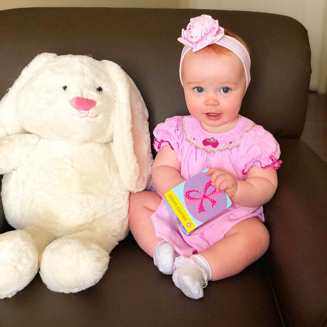 Carolina joined the competition — help win amazing prizes! baby, cheek, child, ear, face, happy, head, people, person, pink, play, plush, room, sitting, skin, smile, stuffed_toy, teddy_bear, textile, toddler