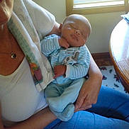 Jahari is registered to the contest to win money with this photo: abdomen, arm, child, childbirth, day, finger, fun, furniture, girl, hand, infant, joint, leg, nap, product, room, sitting, textile, toddler, trunk