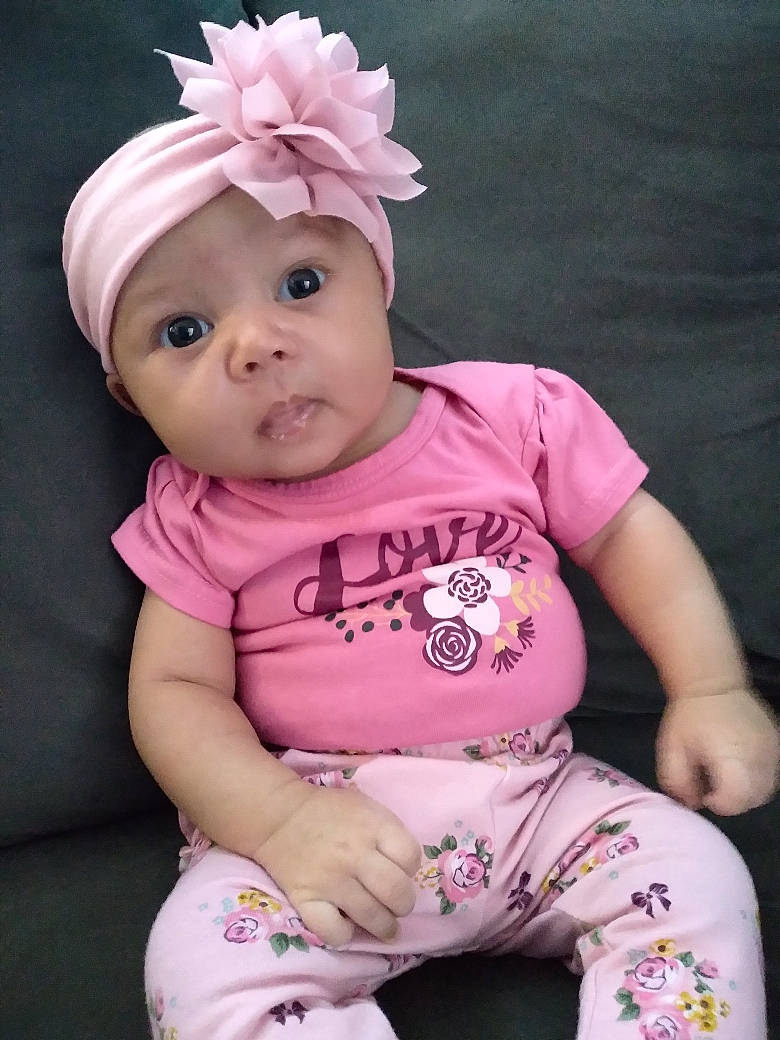 Makennah joined the competition — help win amazing prizes! arm, baby, baby_toddler_clothing, cap, cheek, child, happy, headgear, headwear, human, human_body, lip, magenta, person, pink, purple, skin, sleeve, t_shirt, textile