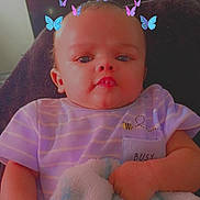 Derrick is registered to the contest to win money with this photo: baby, infant, child, portrait, sitting, chair, blanket, plush_toy, butterfly_filter, digital_stickers, colorful, face, eyes, clothing, striped_shirt, smiling, indoor, home, close_up, photograph