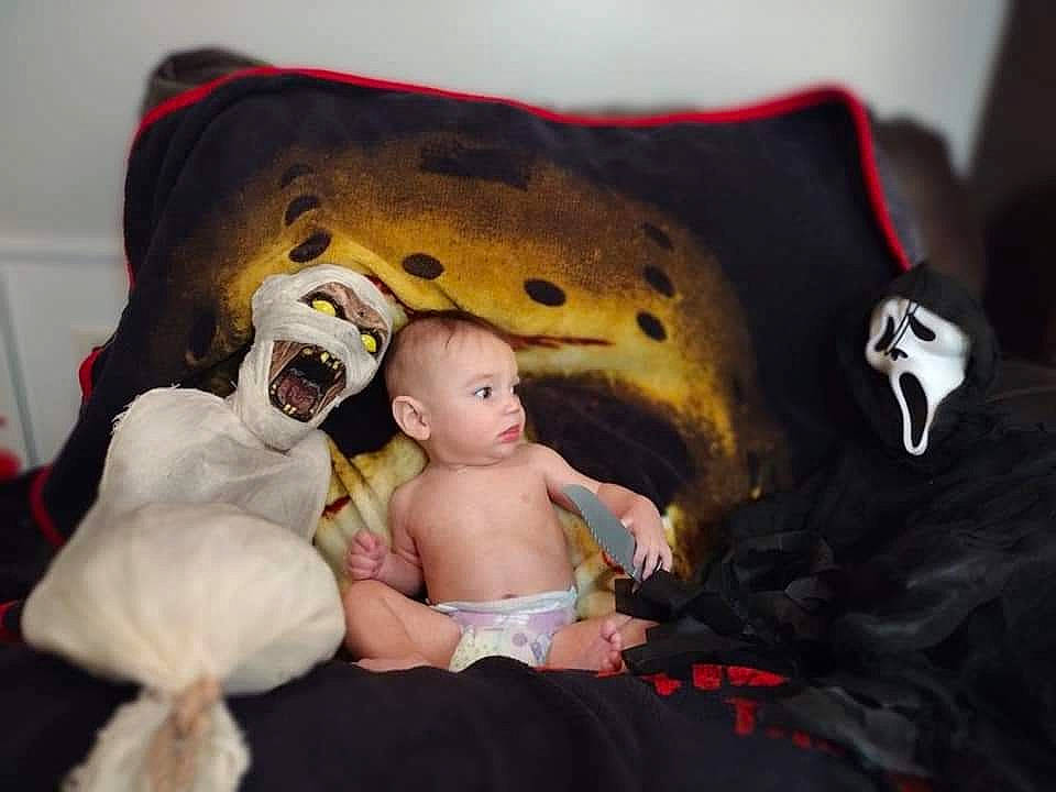Orion is registered to the contest to win money with this photo: art, baby, baby_toddler_clothing, bed, carmine, comfort, costume, eye, fun, fur, happy, head, human_body, person, personal_protective_equipment, plush, sitting, stuffed_toy, teddy_bear, toddler