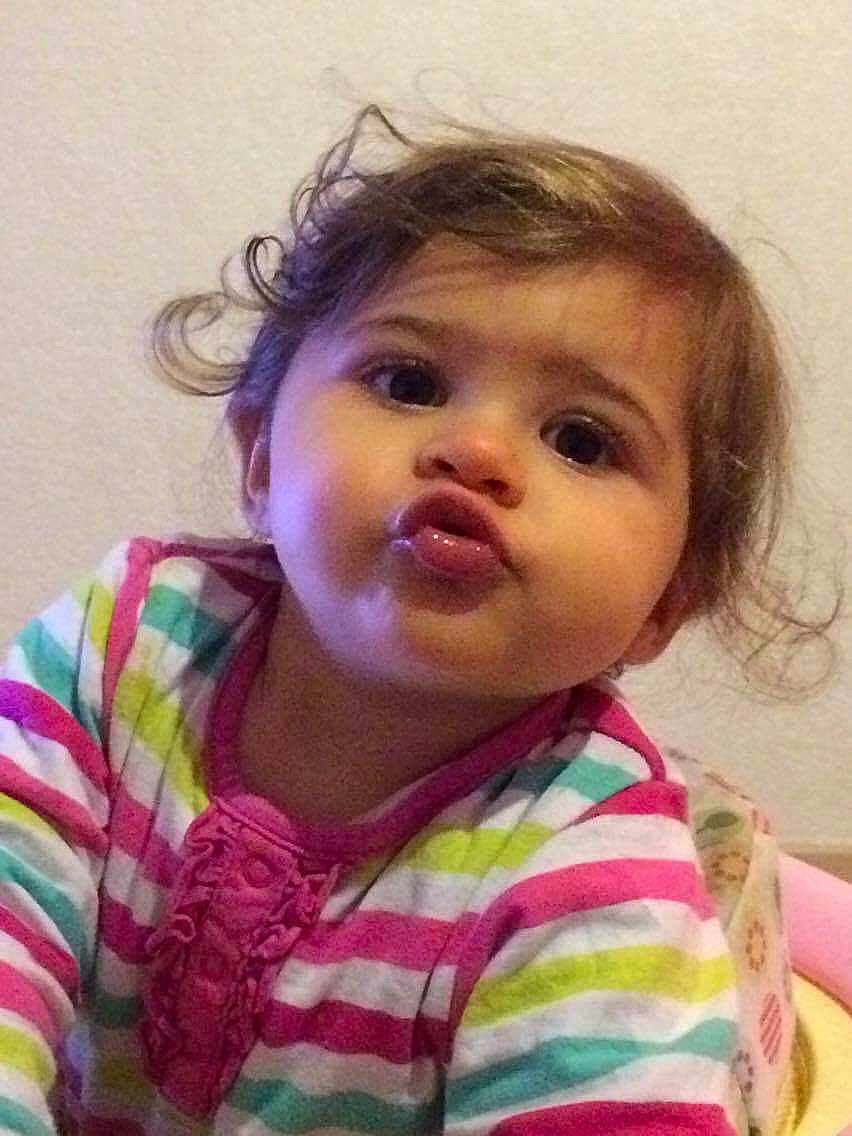 Celena participe au concours pour gagner de l'argent avec cette photo : toddler, child, baby, face, expression, curly_hair, pout, striped_shirt, colorful_clothing, indoors, portrait, cute, young_child, person, skin, head, eyes, mouth, hair, background