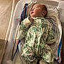 Jordan is registered to the contest to win money with this photo: newborn, baby, sleeping, infant, hospital, bassinet, blanket, clothing, socks, bed, face, person, cute, cozy, soft, child, resting, indoors, comfort, sleep