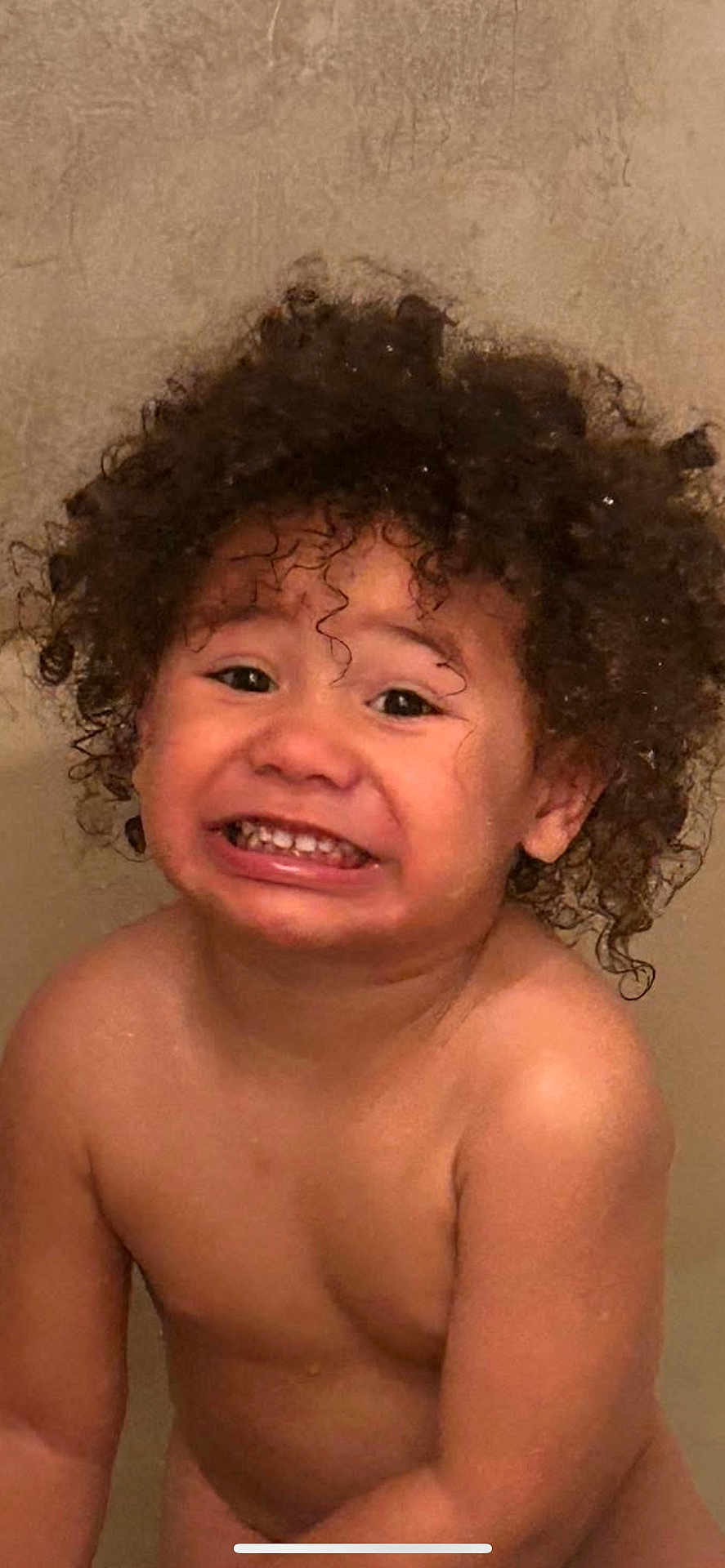 Morgan Xavier is registered to the contest to win money with this photo: toddler, child, curly_hair, smile, bathroom, bare_skin, face, portrait, skin, young_child, expression, indoors, cute, happy, water_drops, person, emotion, funny_face, head, shoulders