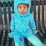 Morgan Xavier joined the competition — help win amazing prizes! child, toddler, costume, monster, blue, purple_spots, bench, outdoor, leaves, fall, cute, fluffy, hood, paws, expression, serious, seat, clothing, person, window