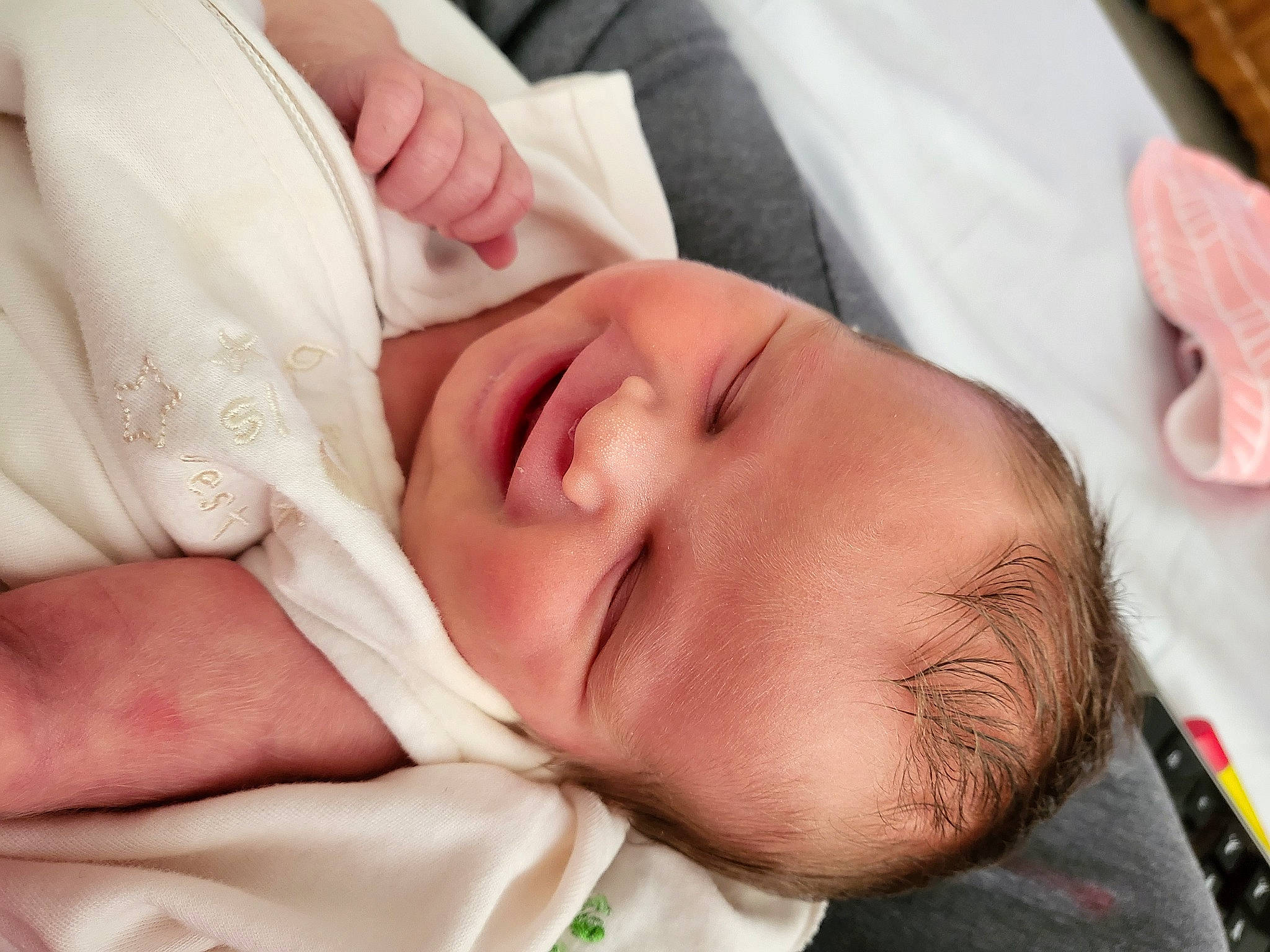 Katie is registered to the contest to win money with this photo: arm, baby, baby_toddler_clothing, cheek, child, chin, comfort, ear, eye, eyebrow, eyelash, finger, gesture, head, mouth, nail, nose, person, skin, thumb