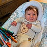Raelynn is registered to the contest to win money with this photo: baby, infant, smiling, winnie_the_pooh, baby_seat, toy, indoor, wooden_floor, clothing, cute, child, person, happy, home, furniture, playful, portrait, cozy, comfort, young_child