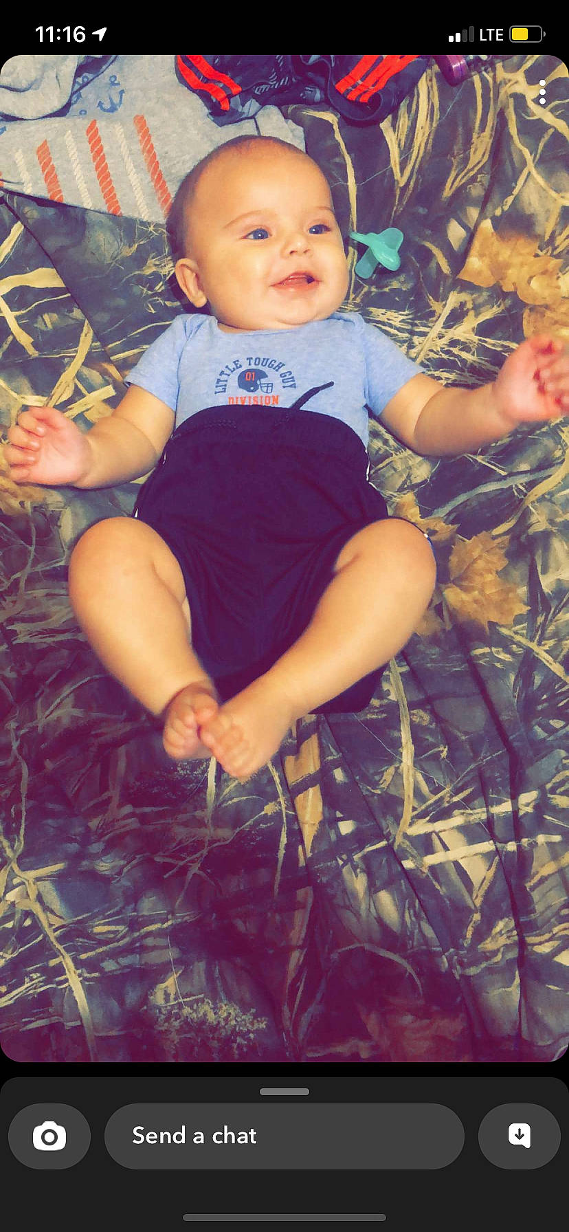 Gunner is registered to the contest to win money with this photo: arm, dress, eye, facial_expression, finger, flash_photography, grass, hairstyle, happy, head, human_body, iris, leg, light, organ, people_in_nature, person, photograph, skin, smile