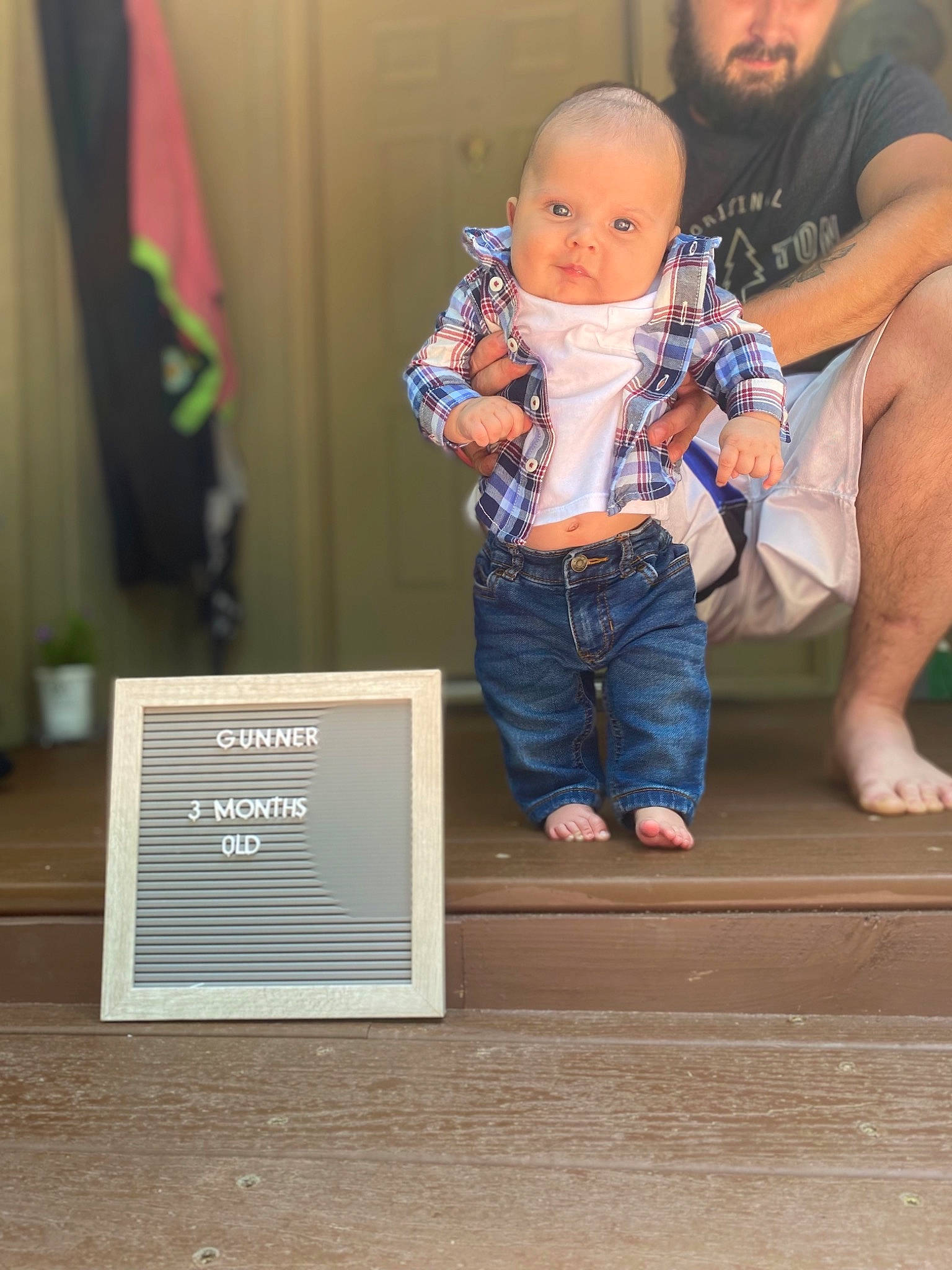 Gunner joined the competition — help win amazing prizes! baby, baby_toddler_clothing, barefoot, child, curtain, denim, electric_blue, event, flag, flooring, fun, leisure, person, room, shorts, sitting, standing, t_shirt, toddler