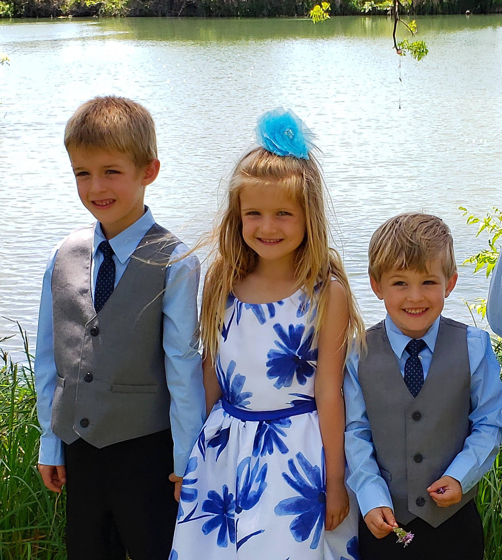 Dixie is registered to the contest to win money with this photo: community, dress, face, facial_expression, family_taking_photos_together, fun, gesture, hairstyle, happy, interaction, joy, lake, leisure, mammal, people_in_nature, person, photograph, plant, smile, social_group