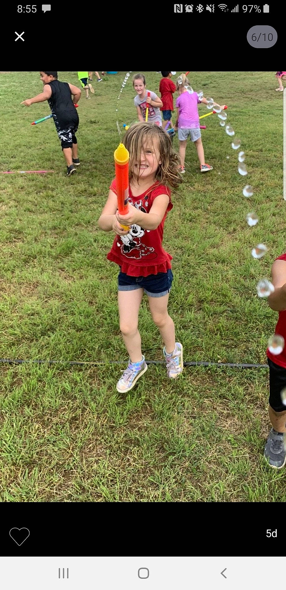 Dixie is registered to the contest to win money with this photo: boot, child, footwear, fun, grass, grassland, human_leg, joy, knee, leg, leisure, person, pink, player, recreation, shoe, shorts, smile, sneakers, sports