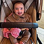 baby, child, smiling, stroller, bugaboo, clothing, pink, brown, socks, beads, bracelet, fabric, happy, indoor, seat, person, cute, portrait, infant, toy