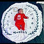 baby, bedroom, blanket, circular_blanket, cute, decorative, face, football_club, infant, liverpool, lying_down, milestone, months, numbers, onesie, peaceful, red_clothing, sleeping, soft_texture, wooden_ring