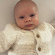 Honey joined the competition — help win amazing prizes! baby, beige_color, buttoned_clothing, child, close_up, cream_color, cute, ear, eyes, face, head, infant, knitted_sweater, lying_down, mouth, nose, portrait, skin, soft_texture, warm_clothing