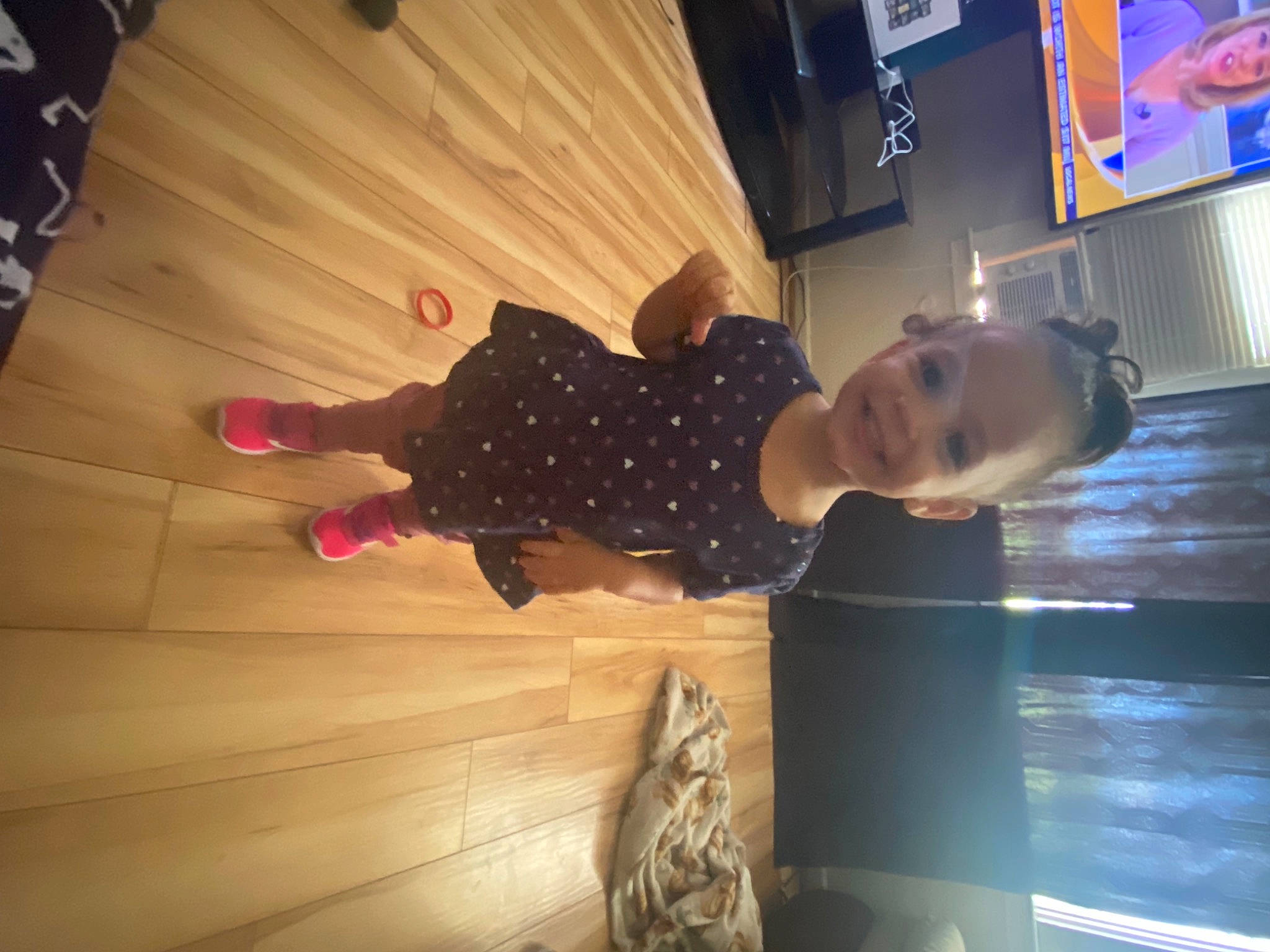Kaiya joined the competition — help win amazing prizes! child, display_device, entertainment, flooring, fun, hardwood, human_leg, joy, led_backlit_lcd_display, pattern, person, room, smile, standing, television, toddler, wood