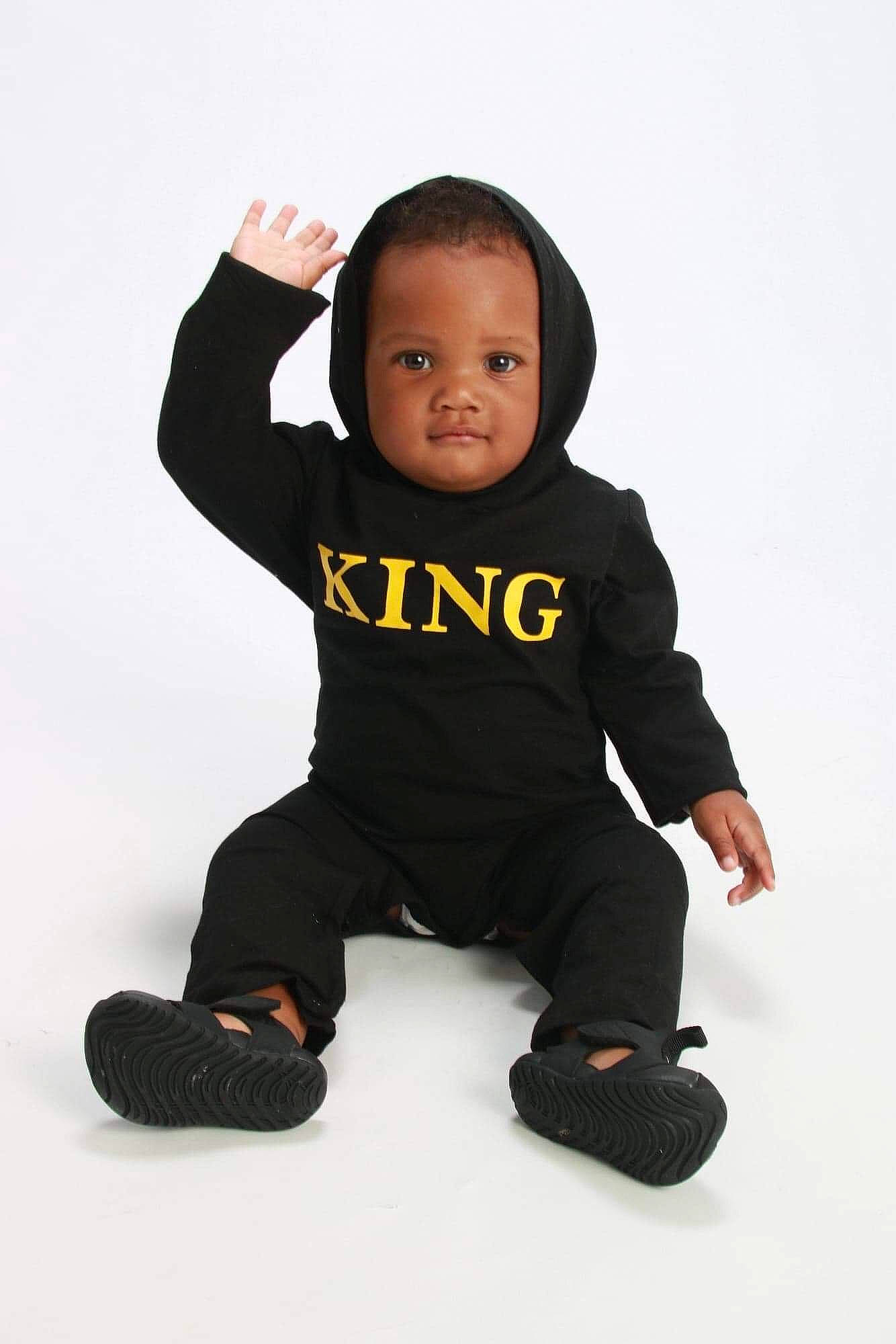 Aydan joined the competition — help win amazing prizes! arm, baby, baby_toddler_clothing, black, child, child_model, head, outerwear, person, photo_shoot, photography, sitting, sleeve, smile, standing, t_shirt, toddler, white