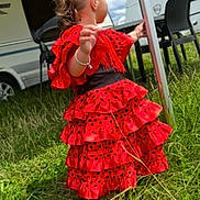 Tokyo Laisis participe au concours pour gagner de l'argent avec cette photo : toddler, red_dress, flamenco_style, polka_dots, grass, outdoor, camper, child, young_child, back_view, fence_post, chair, black_chair, nature, summer, sunny, curly_hair, bracelet, dress, playing