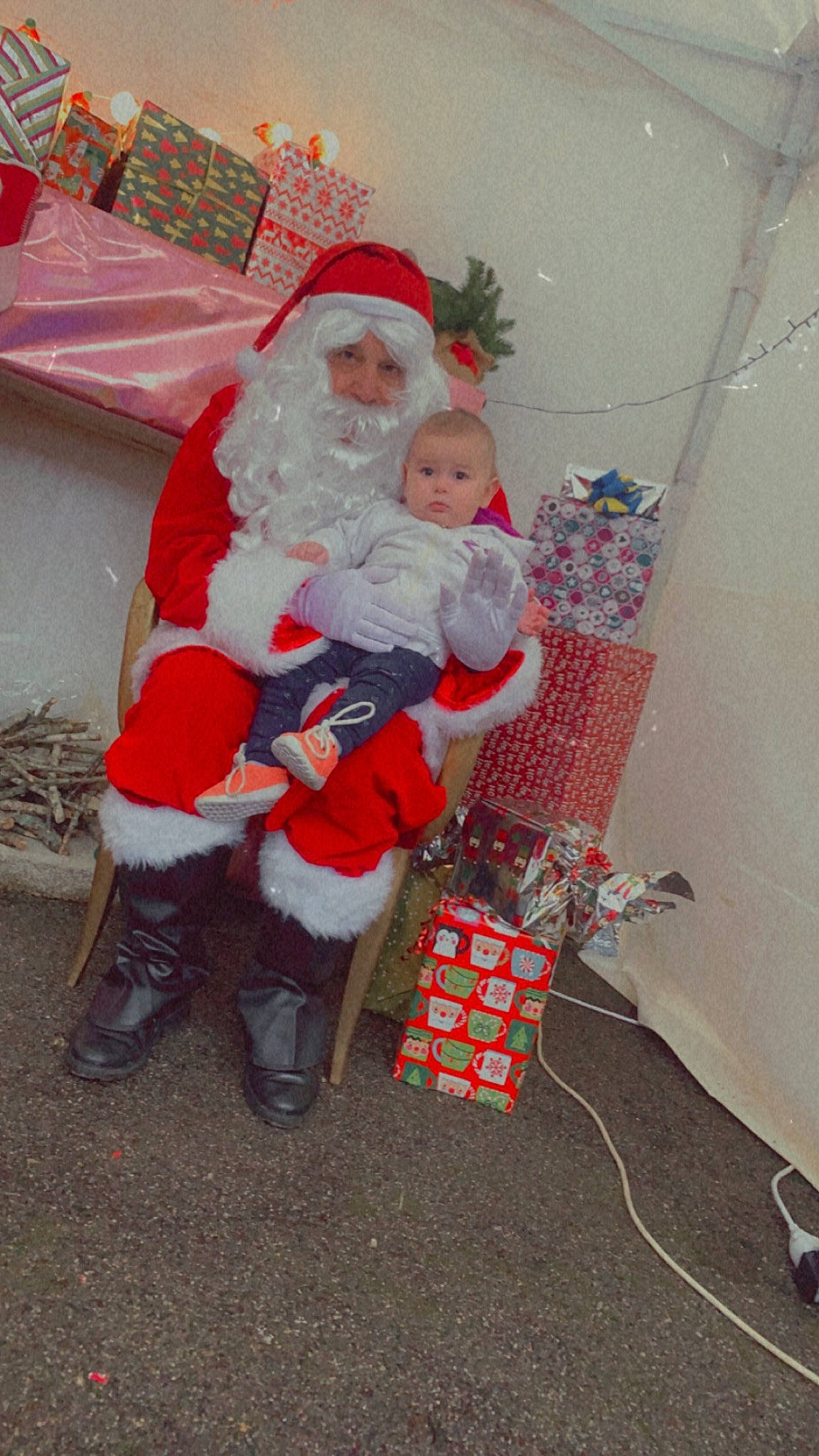 Lya participe au concours pour gagner de l'argent avec cette photo : baby, beard, carmine, child, christmas, christmas_decoration, christmas_eve, christmas_ornament, event, fictional_character, fun, hat, headwear, holiday, interior_design, lap, person, santa_claus, sitting, toddler